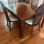 Extendable dining table with chairs